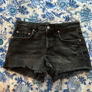 Pair of black jean shorts from Free People. Size 25 with a few rips and fringe.